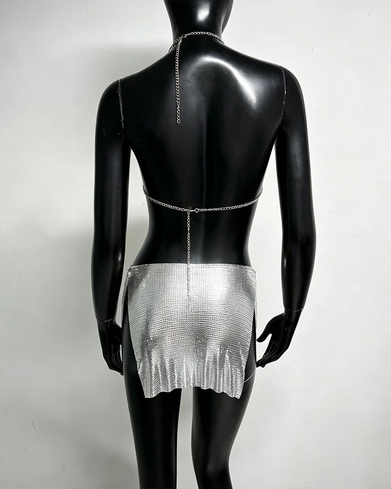 Silver metallic chain bra top and mini skirt set on mannequin, open back chains