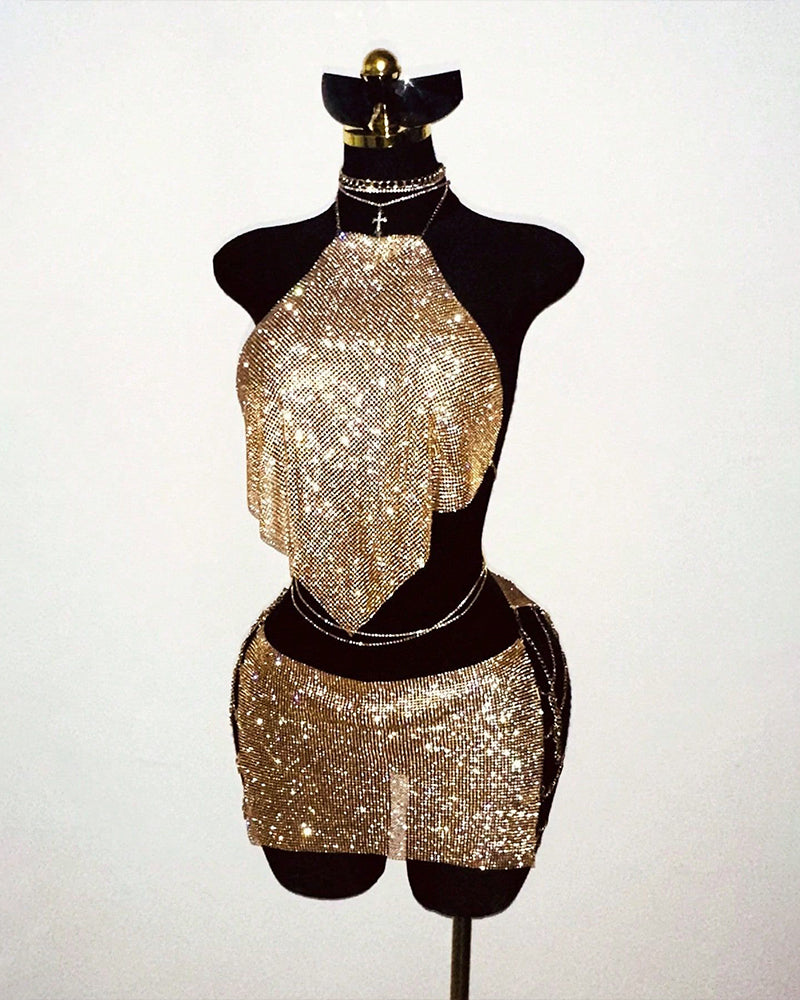 Gold rhinestone halter top and mini skirt set on mannequin, matching fringe