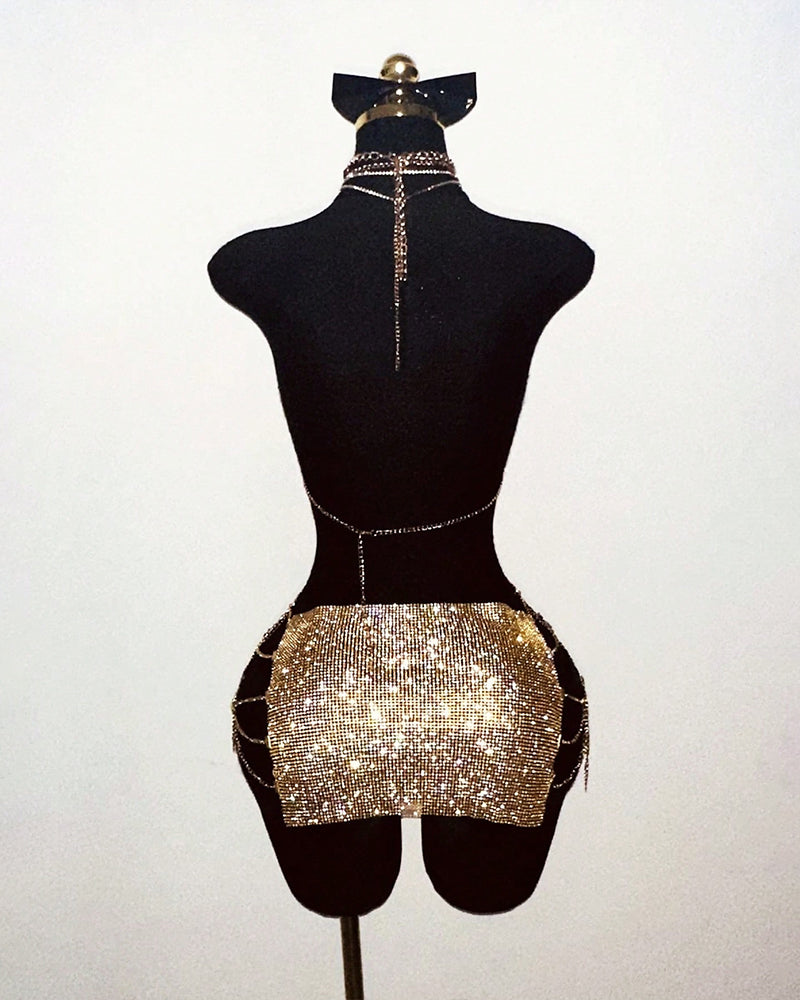 Gold rhinestone halter top and mini skirt set on mannequin with long chain ties