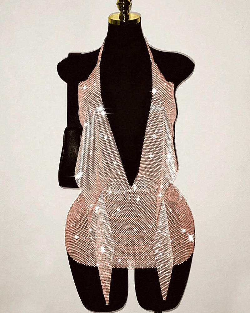 Gold rhinestone fishnet halter mini dress on mannequin with open-back deep V