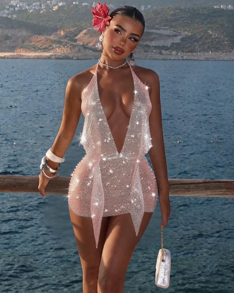 White rhinestone fishnet halter mini dress with plunging open back and jagged hem