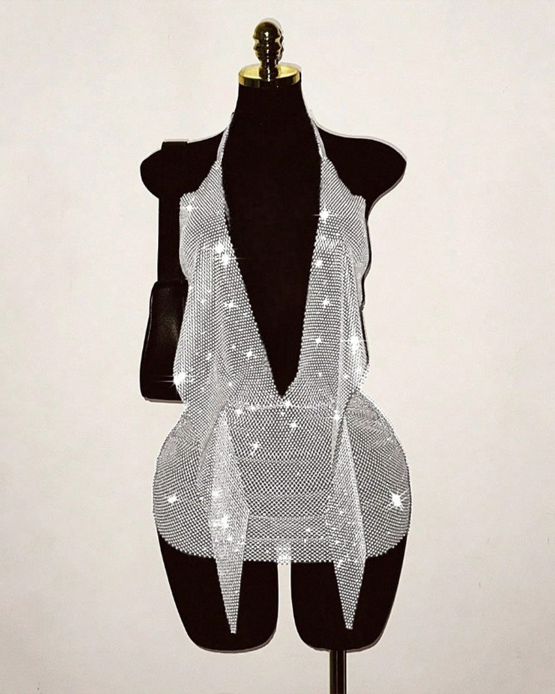 Silver rhinestone fishnet halter mini dress on mannequin with open-back design