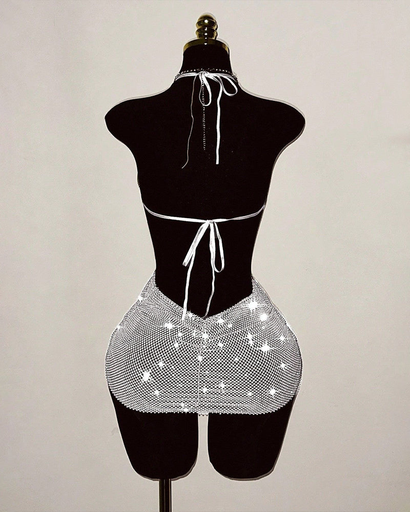 Silver rhinestone fishnet halter mini dress with tie halter and open-back cutout