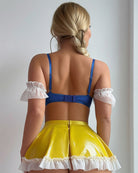 Princess lingerie set back view: blue bra straps, yellow ruffle skirt, fishnet stockings