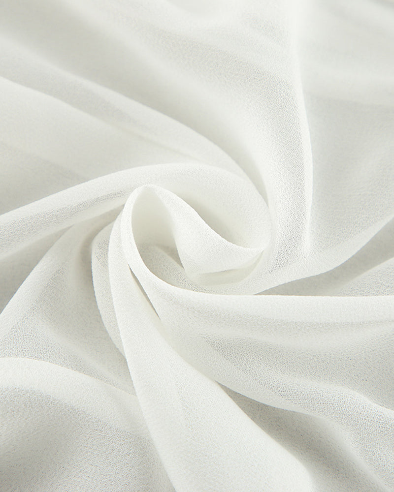 White chiffon fabric close-up with soft, airy drape