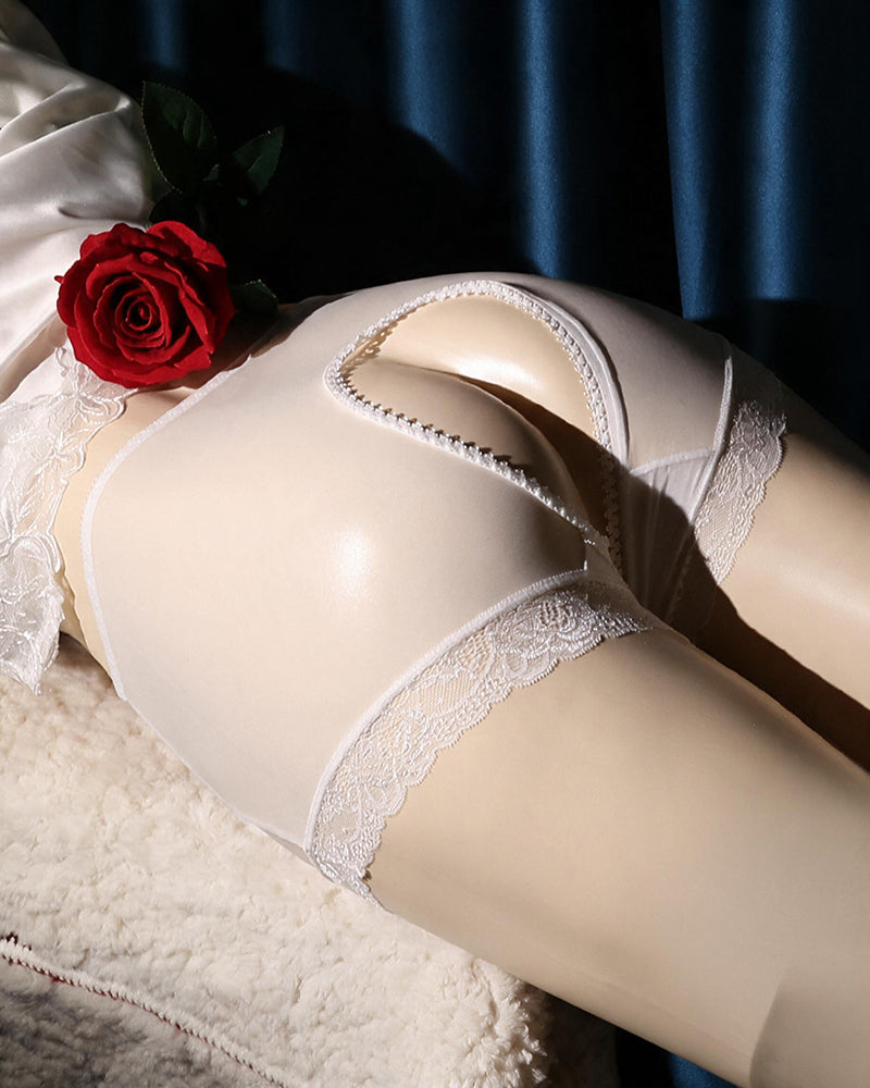 White lace crotchless high-waist panty with scalloped lace edges and cutout front