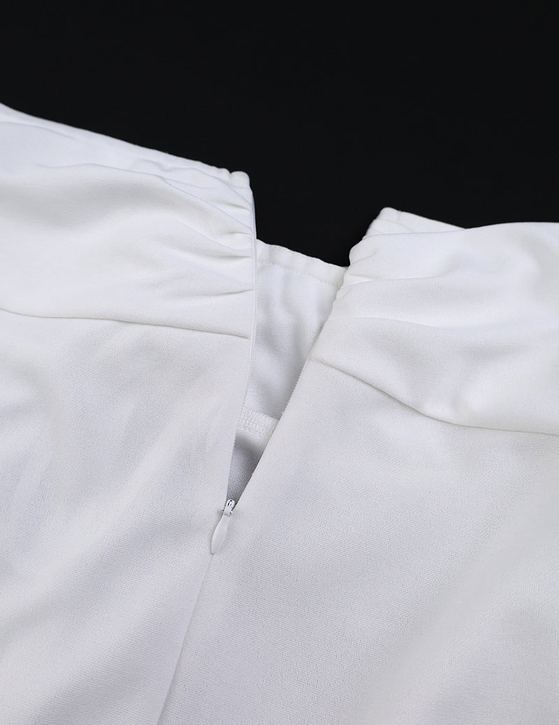 White wide-leg pants close-up of elastic waist and gathered front seam