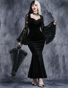 Black velvet mermaid dress with lace bell sleeves, sweetheart neckline, fitted skirt.