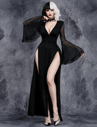 Black deep V slit maxi dress with sheer cape sleeves and flared hem