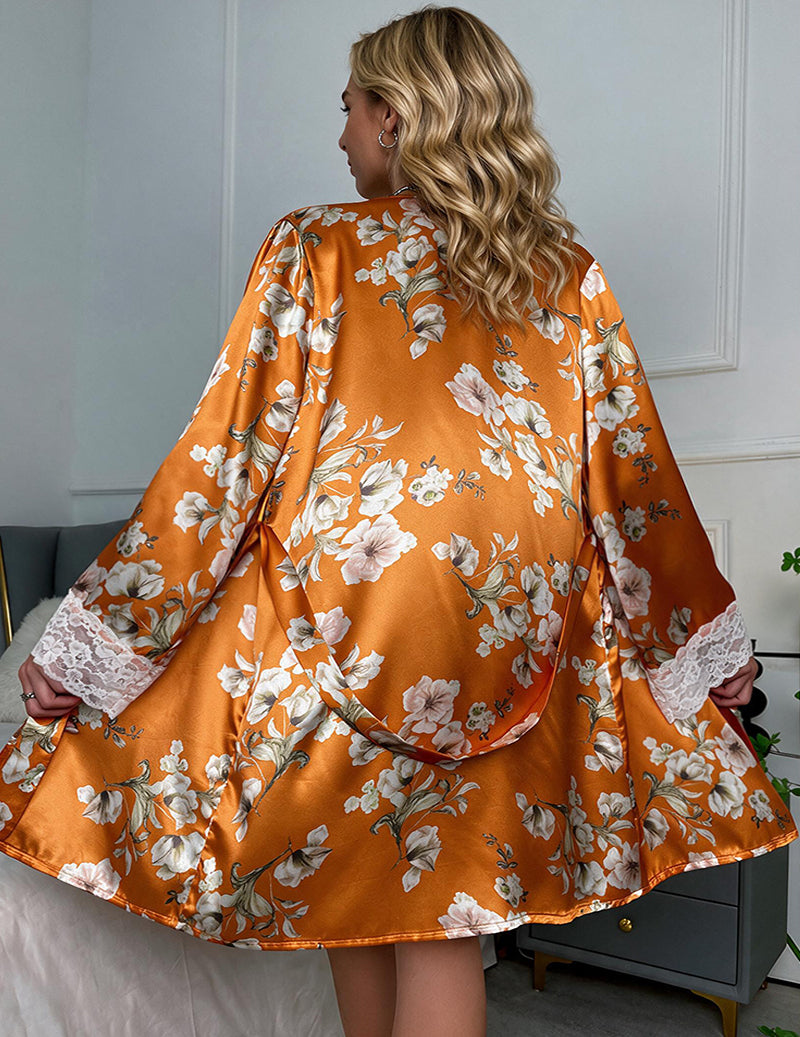 Orange floral satin robe with lace-trim sleeves over lace lingerie set, back view
