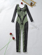 Green sheer mesh jumpsuit with stripe trim, long sleeves, laid flat.