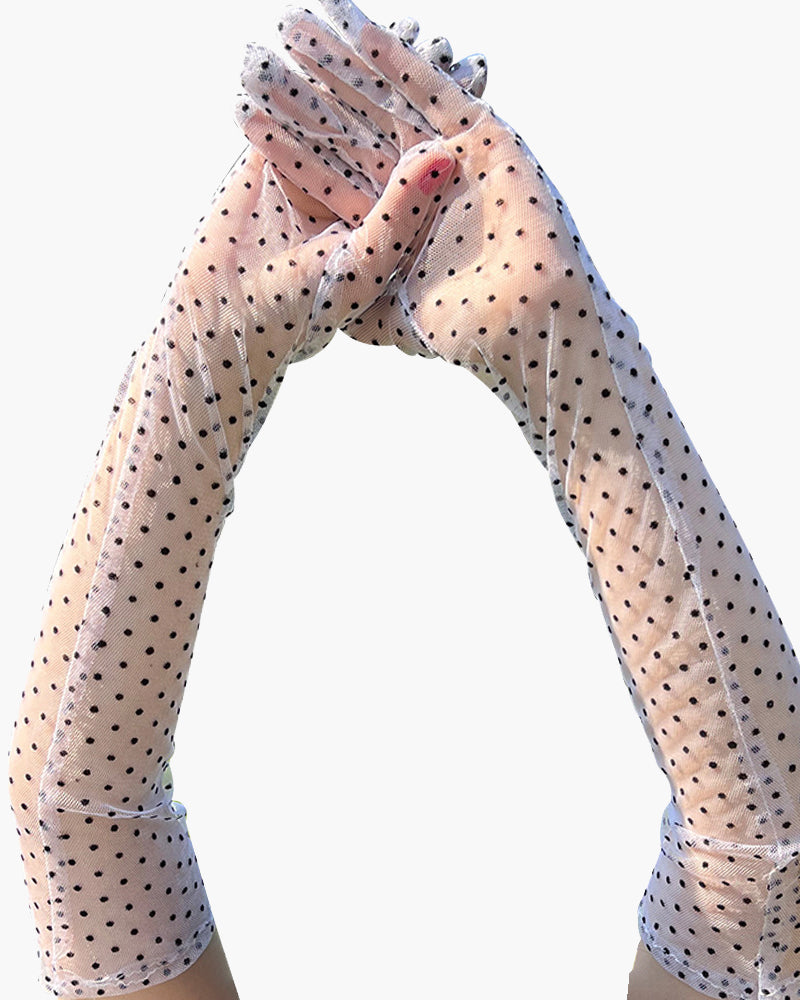 Retro polka dot gloves in sheer mesh, adding elegance and style to any outfit.