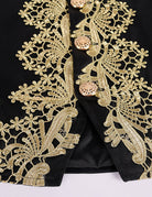 Baroque prince coat front panel with intricate gold embroidery on dark fabric
