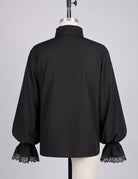 Black gothic shirt with puff sleeves and lace-trim cuffs, back view on mannequin