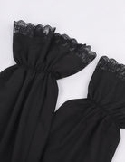 Black blouse sleeve with layered lace cuff and gathered puff at the wrist