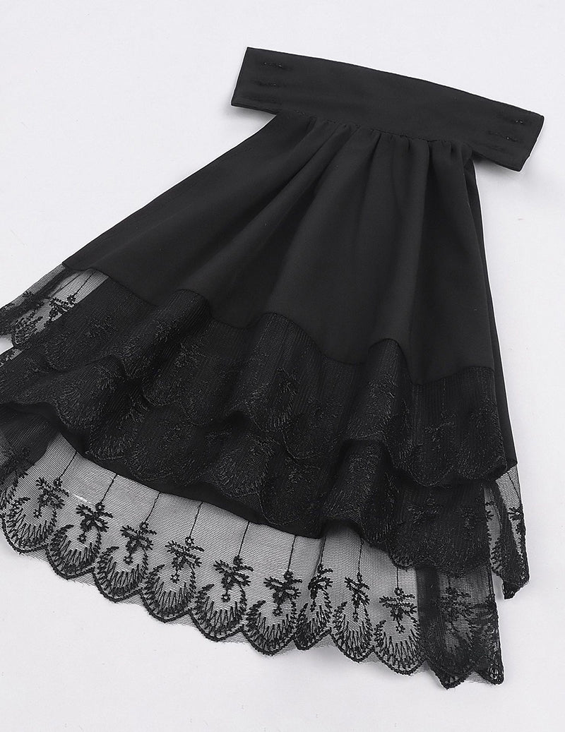 Black ruffled shirt hem with layered lace trim and gathered skirt front