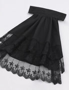 Black ruffled blouse front with lace hem and layered tiered skirt detail