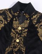 Black stand-collar coat detail with gold baroque patterned trim and two buttons