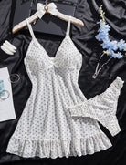 White sheer chiffon babydoll with black dots, bow detail, ruffle hem, and matching G-string