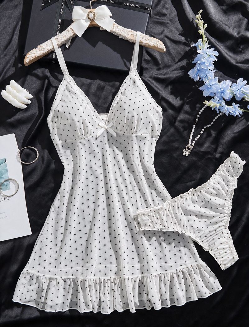 White sheer chiffon babydoll with black dots, bow detail, ruffle hem, and matching G-string