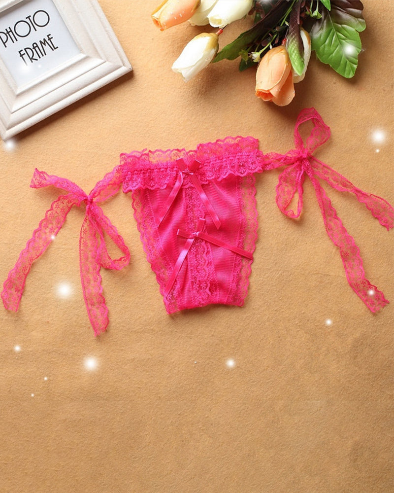 Pink lace crotchless thong panty with adjustable ties and ribbon details, sensual lingerie