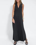 Sleeveless black maxi dress with V-neck. Elegant, floor-length design for a confident style.