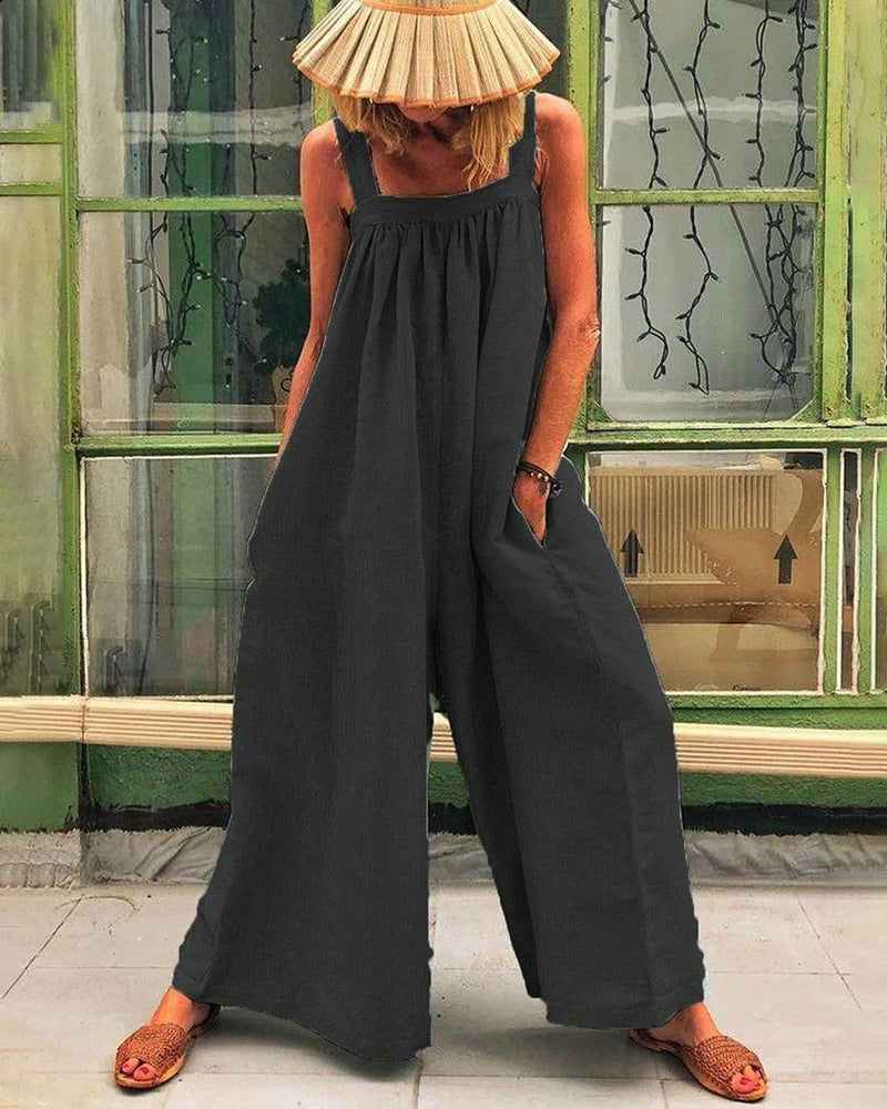 Black linen-cotton jumpsuit with wide legs, square neckline, and pockets, casual style