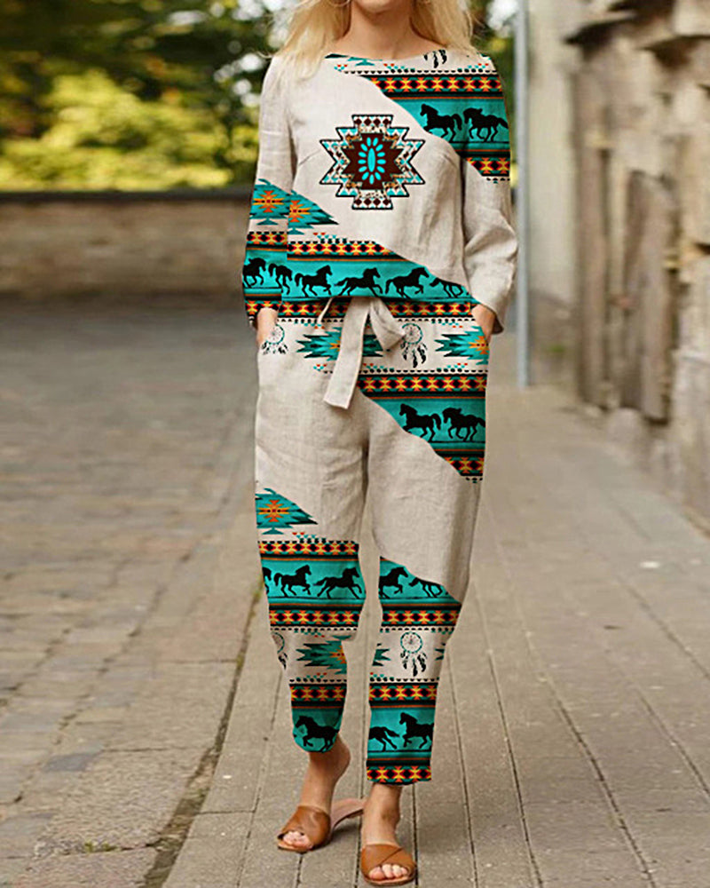 Beige linen two-piece print tracksuit with horse and geometric patterns. Casual style.