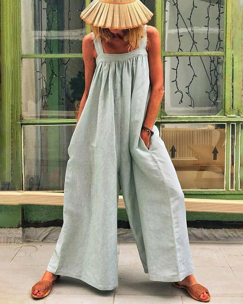 Light blue linen-cotton jumpsuit with wide legs, square neckline, and pockets, casual style